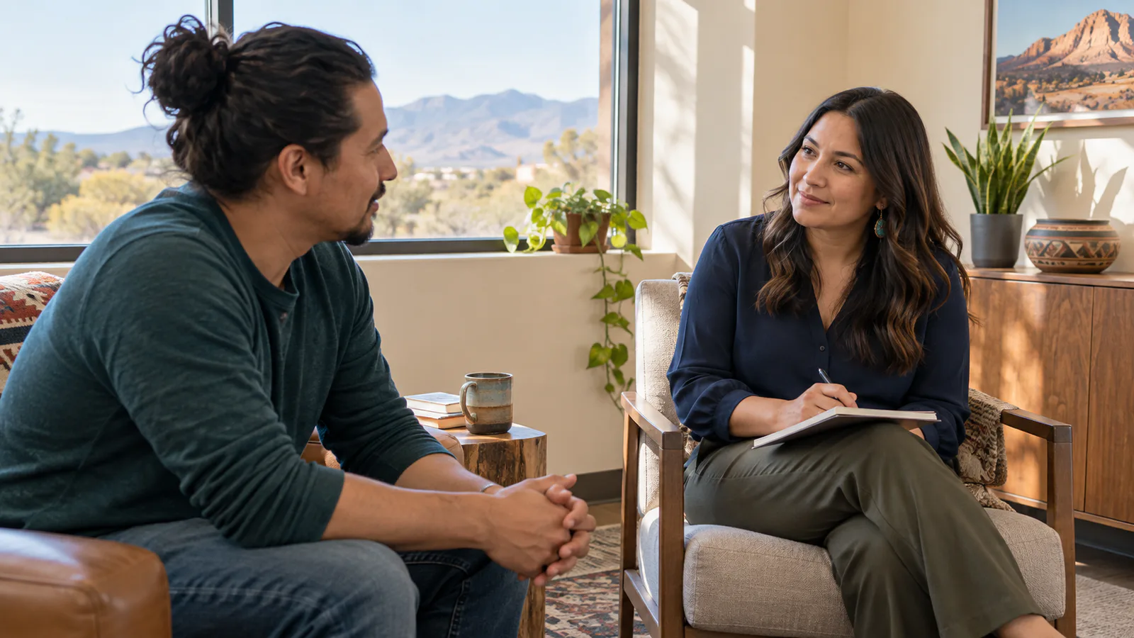 An adult having a calm admissions conversation in a bright New Mexico office