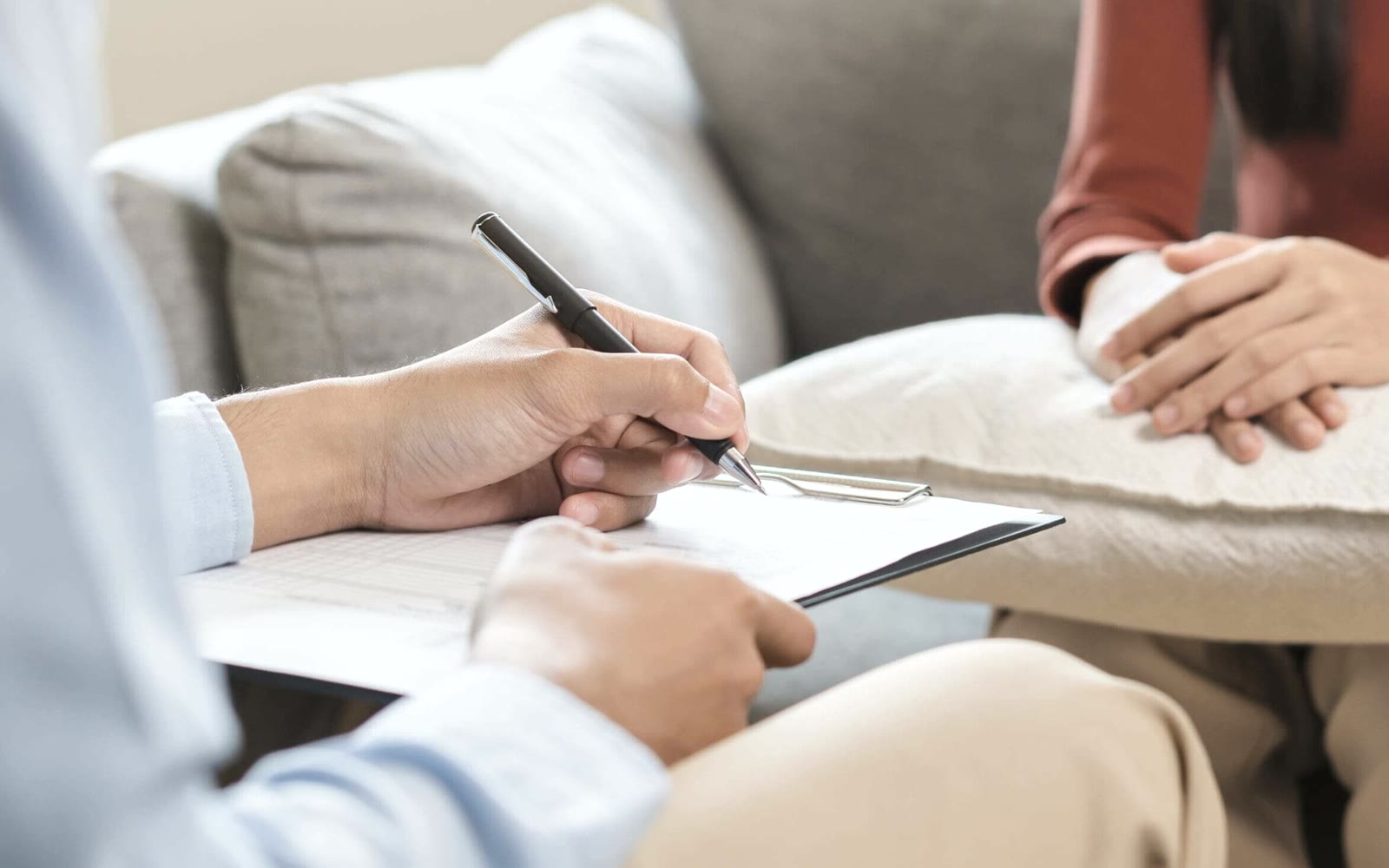 An adult discussing an outpatient support plan with a care professional